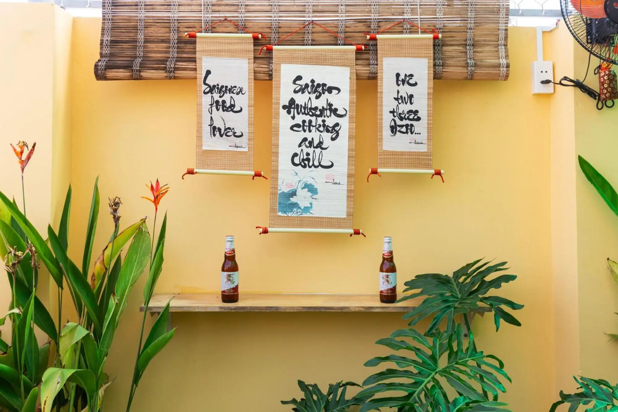 Group of people drinking beer at Saigon Authentic Hostel